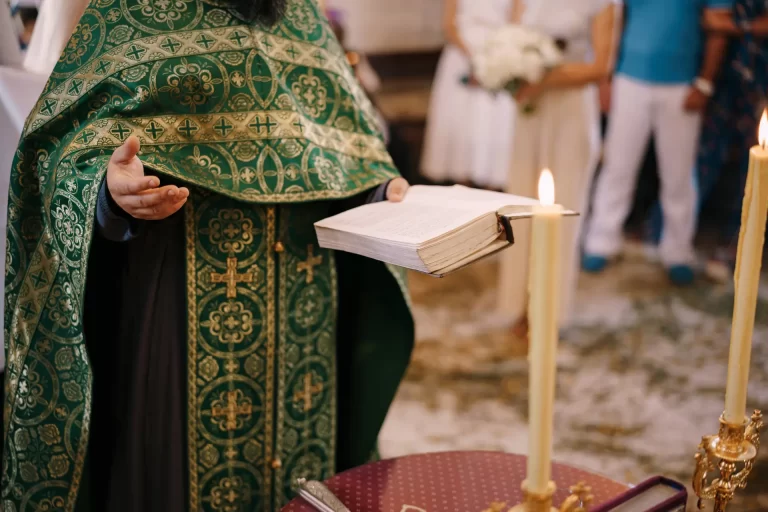 priest-at-the-wedding-holds-a-bible-in-his-hand-2023-11-27-05-03-03-utc (1)